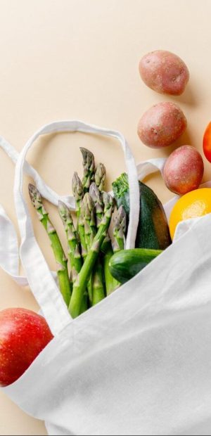 Zero waste concept. Vegetables in textile bag. No plastic. Bright Background. Clever consuming, healthy planet concept.